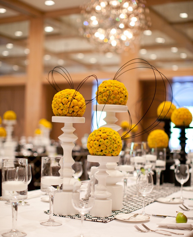 Yellow, Black and White Centerpieces – shared on The Knot
