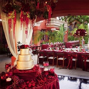 Red Decorations and Cake Table – shared on 9WeddingWebsites