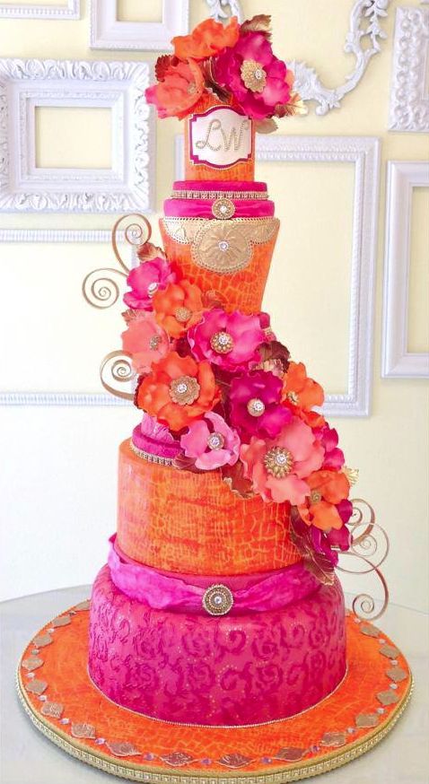 Pink and Orange Tiered Wedding Cake – shared by ModWedding