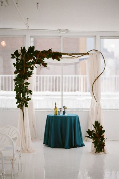 Modern Magnolia and Linen Wedding Alter – shared on Style Me Pretty