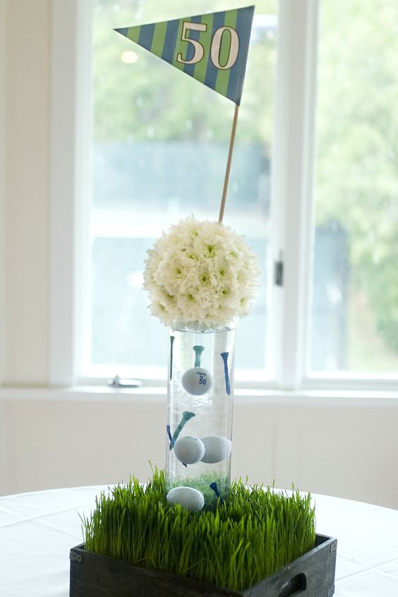 Golf Themed Centerpiece with Grass, Balls, Tees, and Flowers – shared on Pinterest