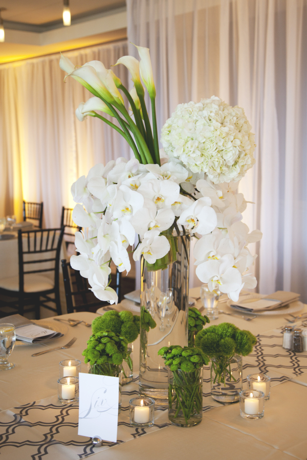 White Orchid, Hydrangea, and Calla Lily Centerpiece with Pops of Green – shared by Elizabeth Anne Designs