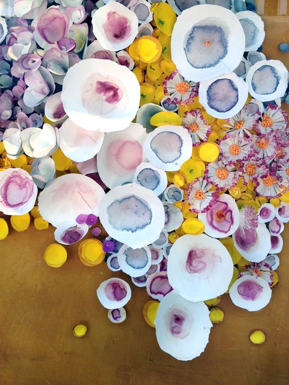 Abstract Watercolor Paper Flowers on a Gold Backdrop Photo Booth Wall – shared in a roundup post by Engaged and Inspired