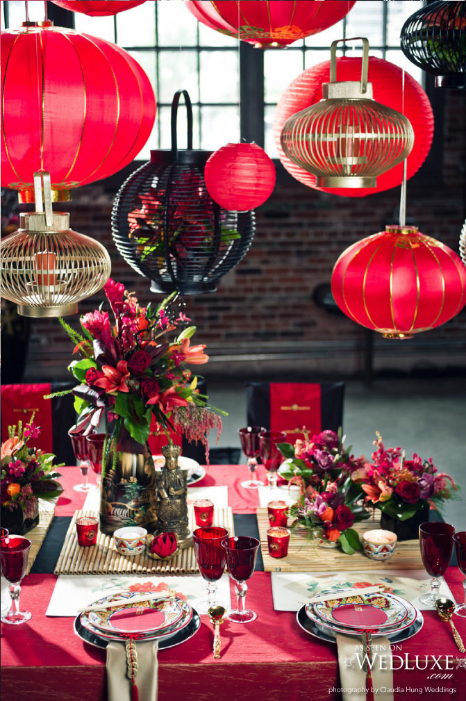 Asian Inspired Tablescape with Red and Gold Paper Lanterns Hanging from Above – shared on WedLuxe