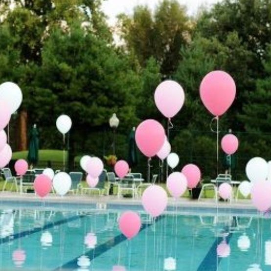 Pink Floating Balloons Pool Décor – shared in a roundup post by How Does She