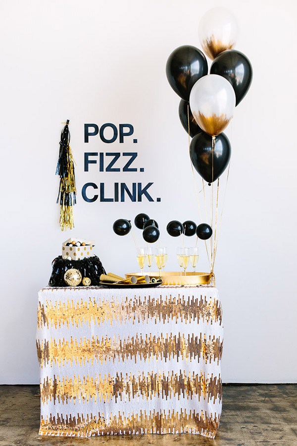 White and Gold Sequined “Pop Fizz Clink” Champagne Station – shared in a roundup on BLovelyEvents