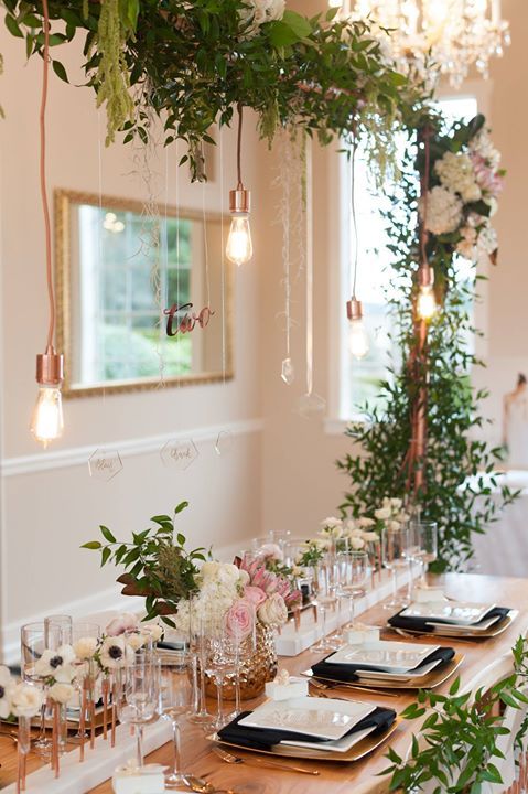Copper Trellis with Greenery and Edison Bulbs Tablescape – shared on Inside Weddings