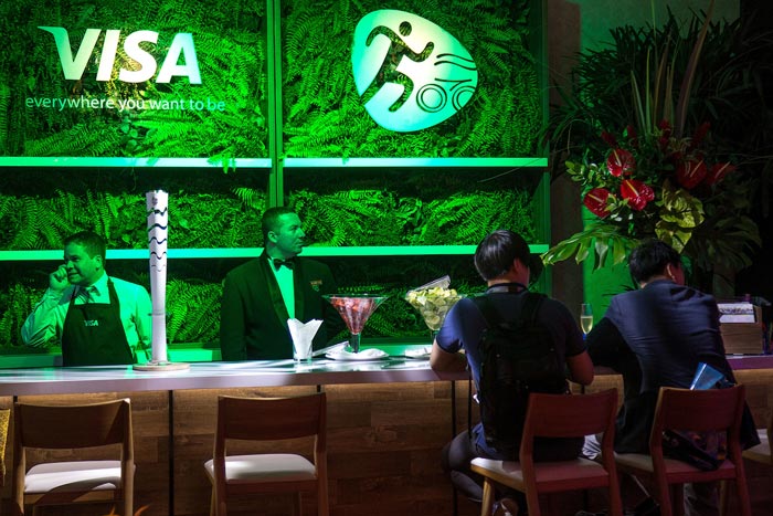 Green Fern Bar with Green Lighting – shared in a roundup by BizBash