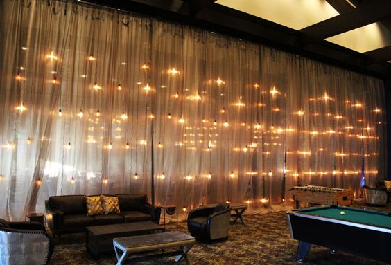 Industrial Edison Bulb Wall with Metallic Draping – shared by In The Event