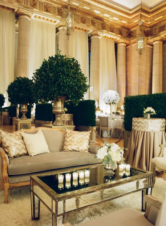 Mirror and Neutral Lounge with Topiary Accents and Boxwood Room Dividers