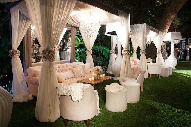 Draped White Lounge Cabanas on the Lawn with Blush Furniture and Crystal Chandeliers – shared by Revelry Events