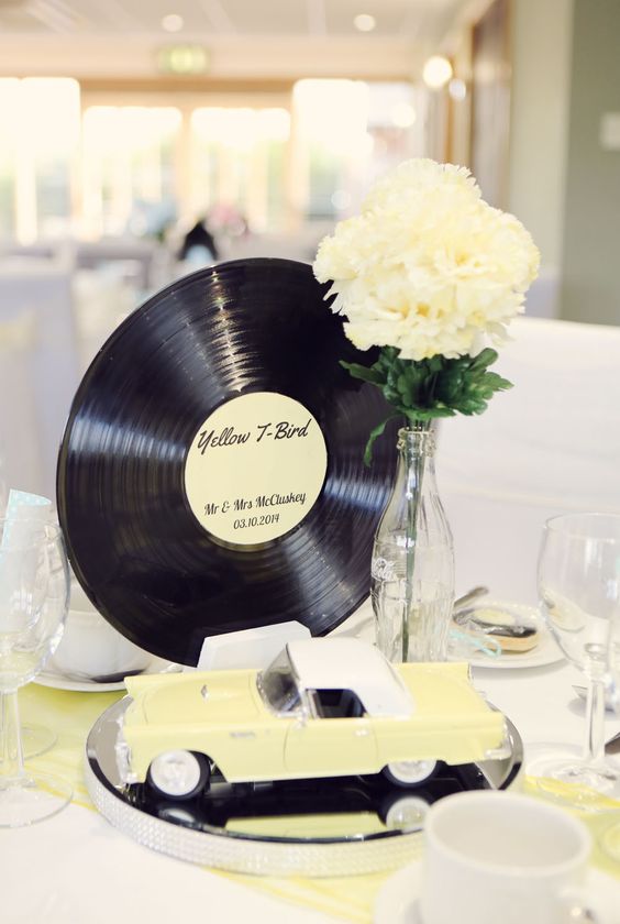 50s Rockabilly Centerpiece with Vintage Car, Coke Bottle, and Record – featured on Rock n Roll Bride